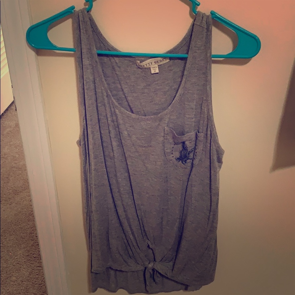 Very cute tank top that ties at the bottom!(: